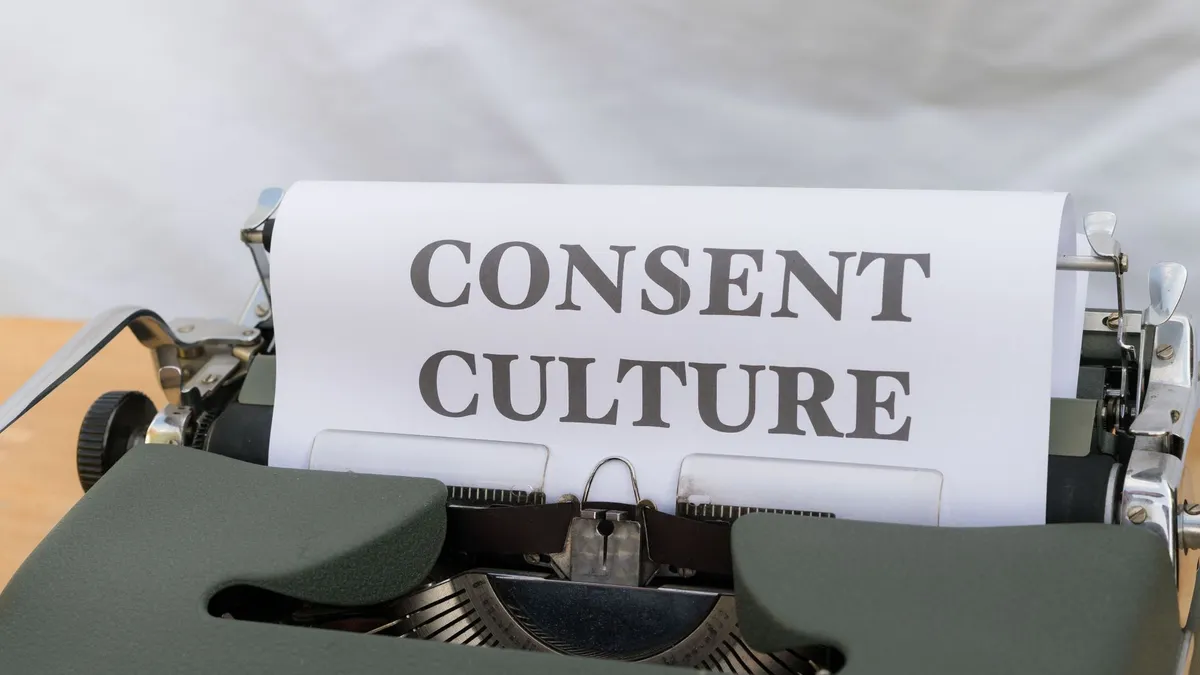 Close-up of the words 'Consent Culture' typed on paper in a vintage typewriter.