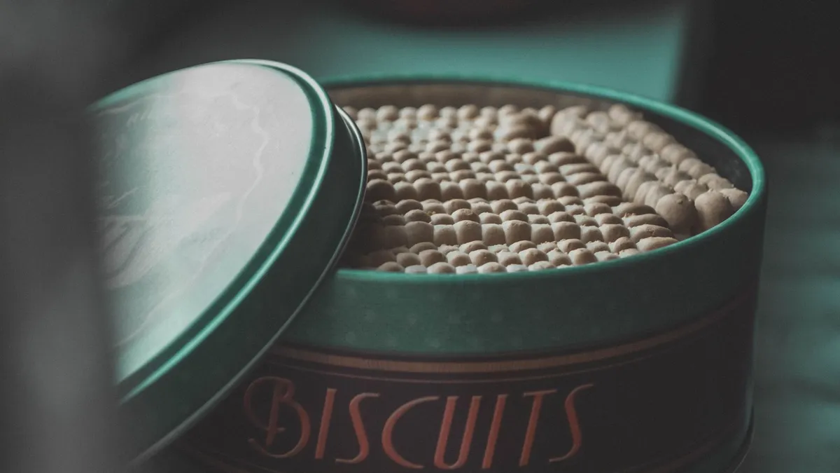 A classic tin filled with biscuits, creating a vintage and cozy feel.