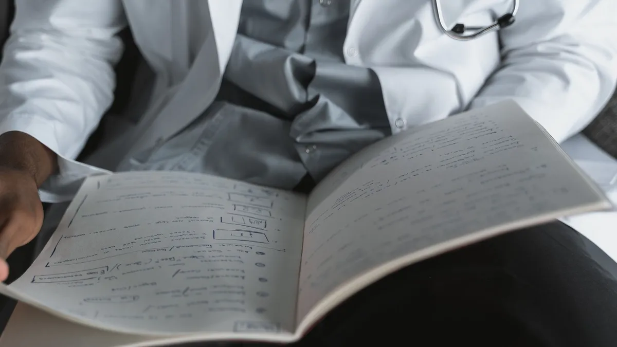 A medical professional reviewing important documents in an office setting.