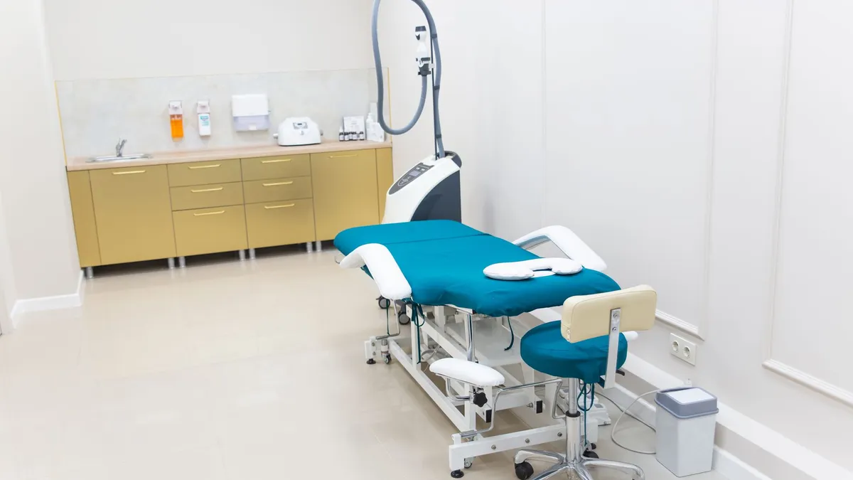 Clean and modern medical examination room with equipment ready for use.