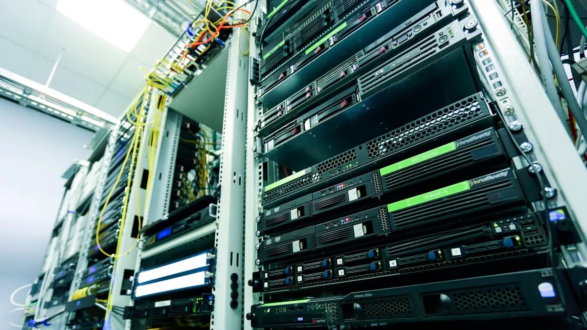 High-tech server rack in a secure data center with network cables and hardware components.