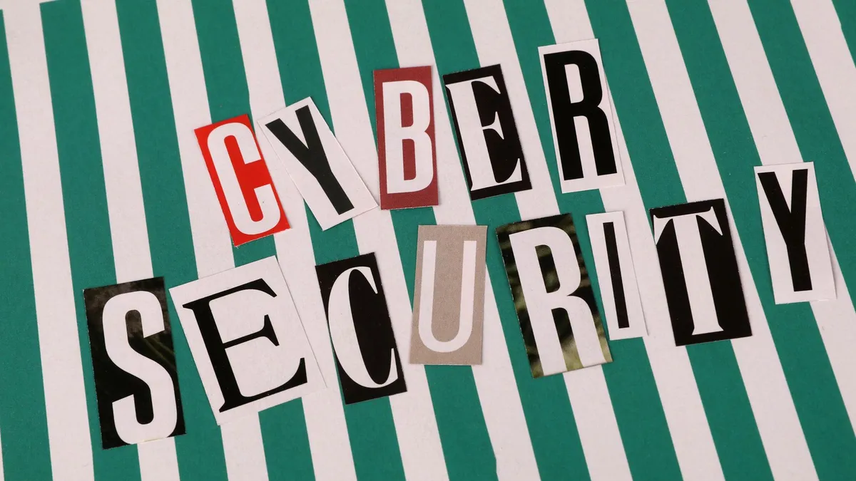 Cyber security concept depicted with a creative text collage on striped background.