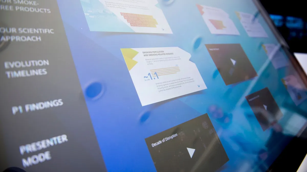 Close-up of a digital touchscreen displaying various data and graphics.