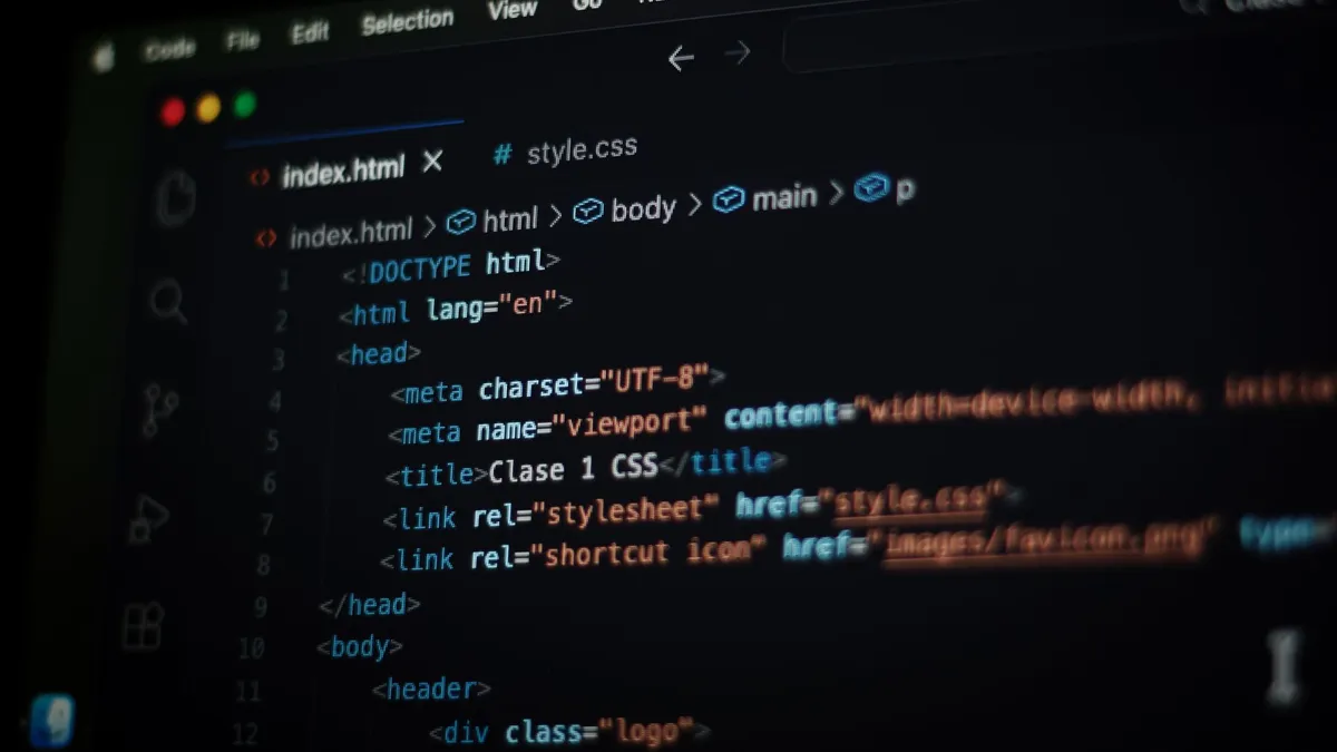 Close-up of HTML code displayed on a computer screen in dark mode, focusing on programming concepts.