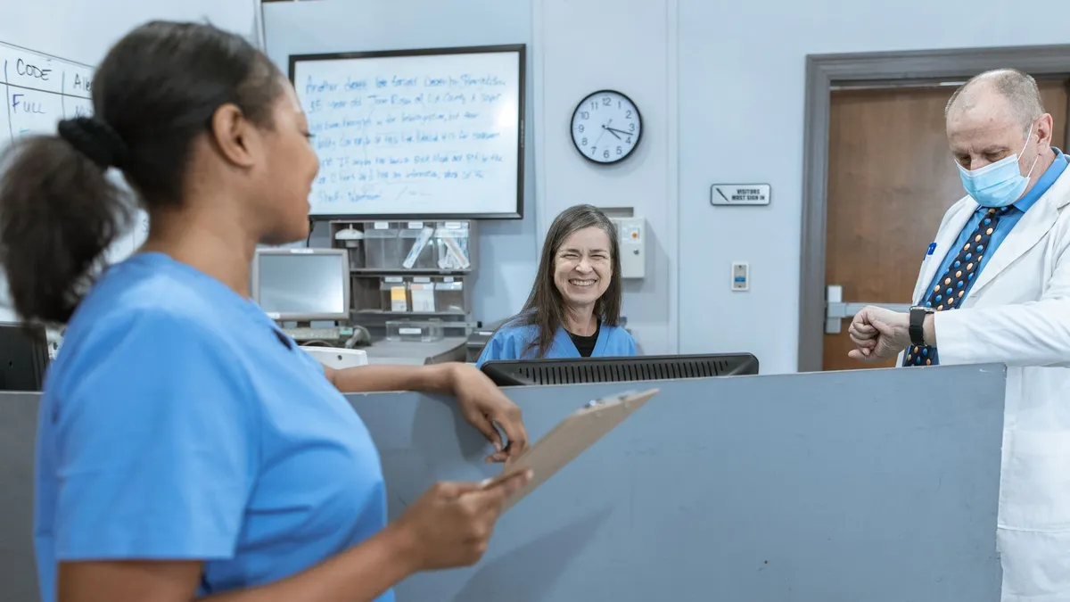 Doctors and nurses working together in a hospital, focused on patient care.