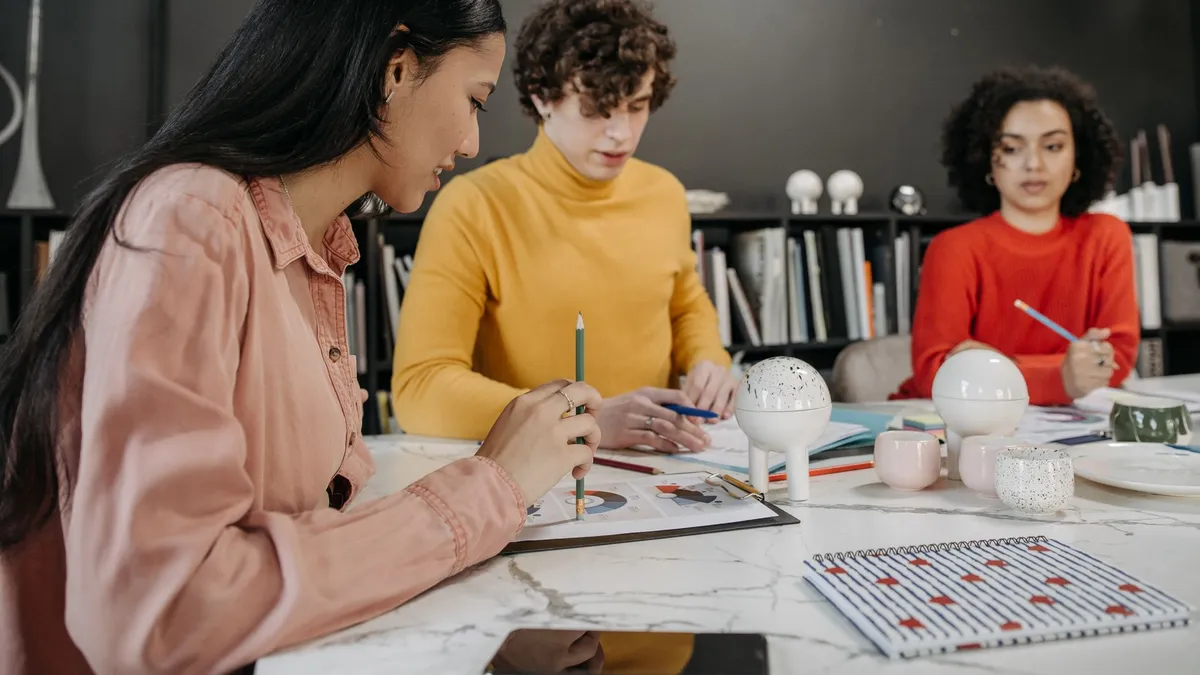 Diverse team planning and strategizing together in a modern office setting.