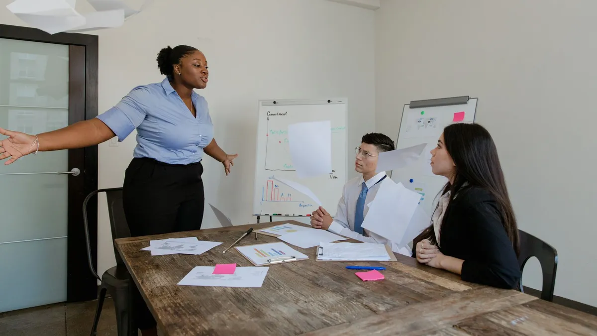 A group of professionals in a heated discussion during a business meeting.