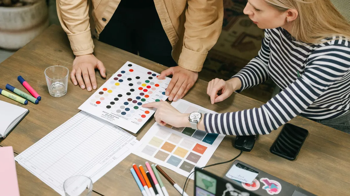 A collaborative team workspace focusing on planning using color charts and documents.