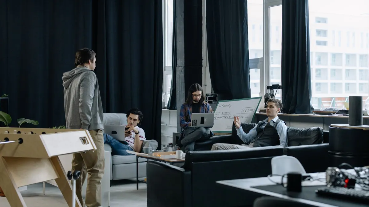 Group of young professionals collaborating in a creative and modern office space.