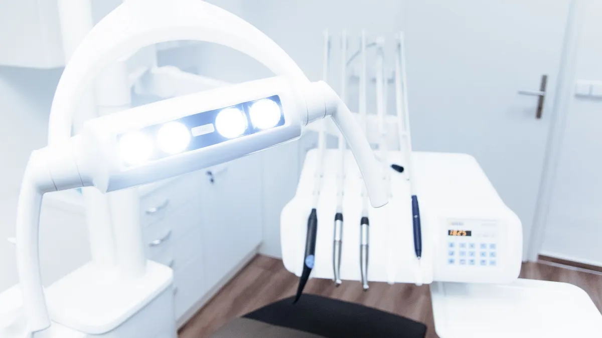Bright and clean modern dental clinic room with advanced dental equipment.