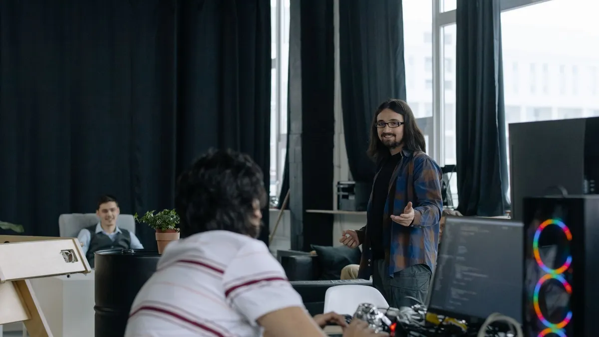 Young professionals collaborating in a modern software company office space.