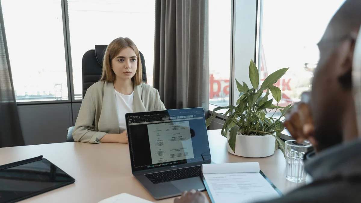 A professional job interview scene in a modern office setting, emphasizing recruitment and career opportunities.