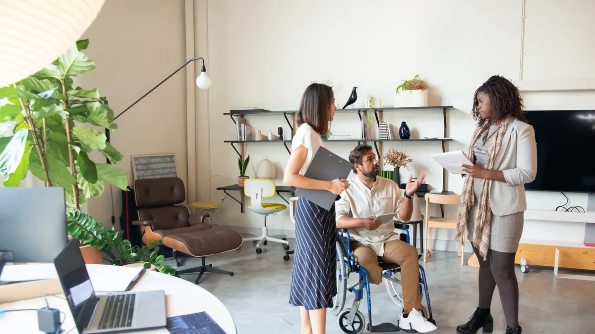 A diverse group of professionals brainstorming in a modern office setting.